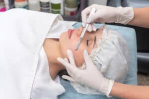 A Young woman getting Dermaplaning Treatment | Luminous Skin Care in Santa Clara, CA